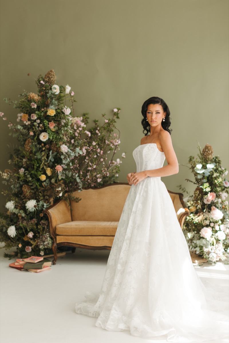 Bride in full gown with elegant waved bridal hairstyle
