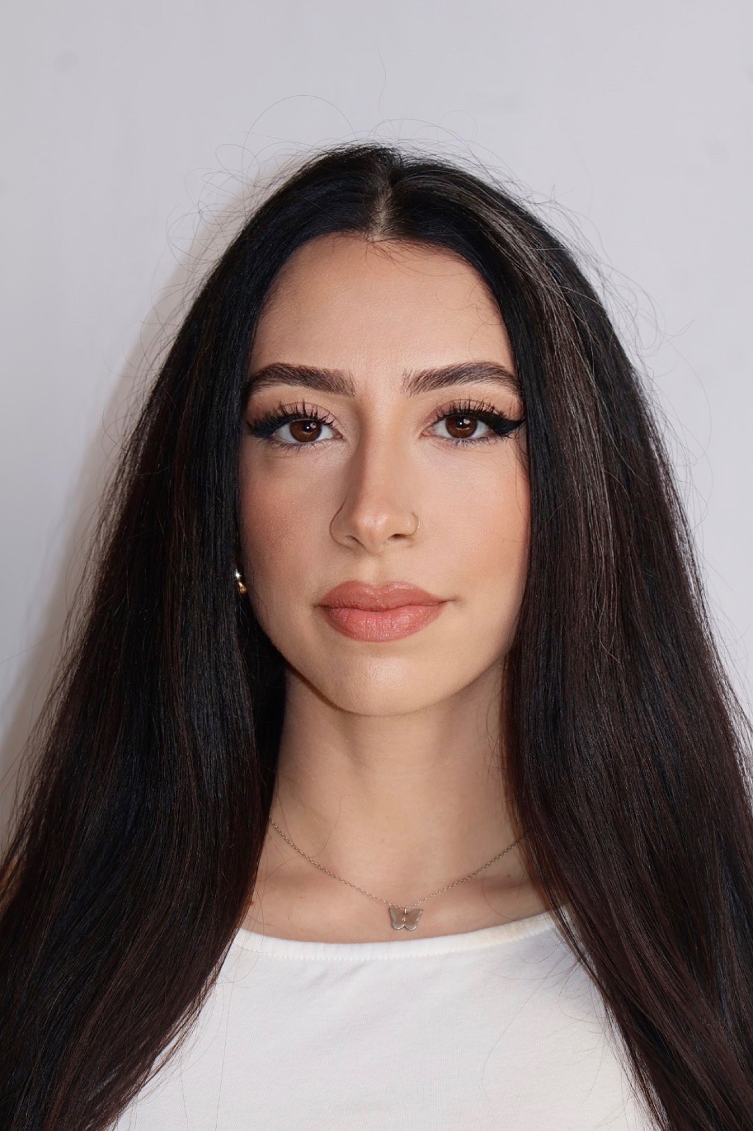 Professional headshot portrait of Varvara Cardenas, New York bridal hairstylist and makeup artist